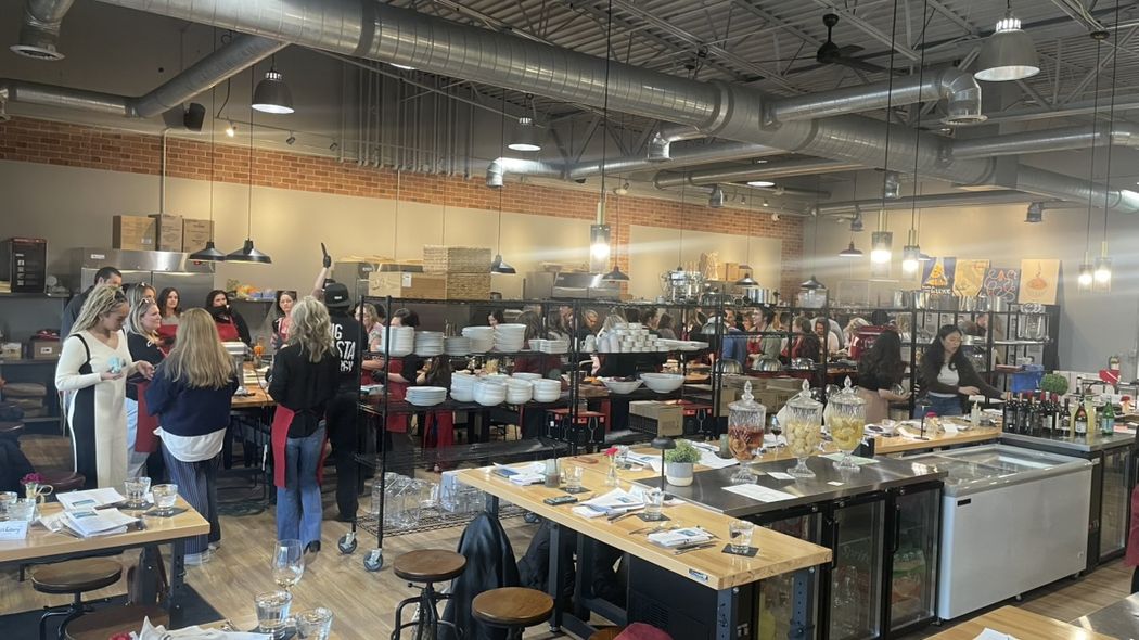 Guests mingling at a private event at The Local Epicurean in East Lansing.
